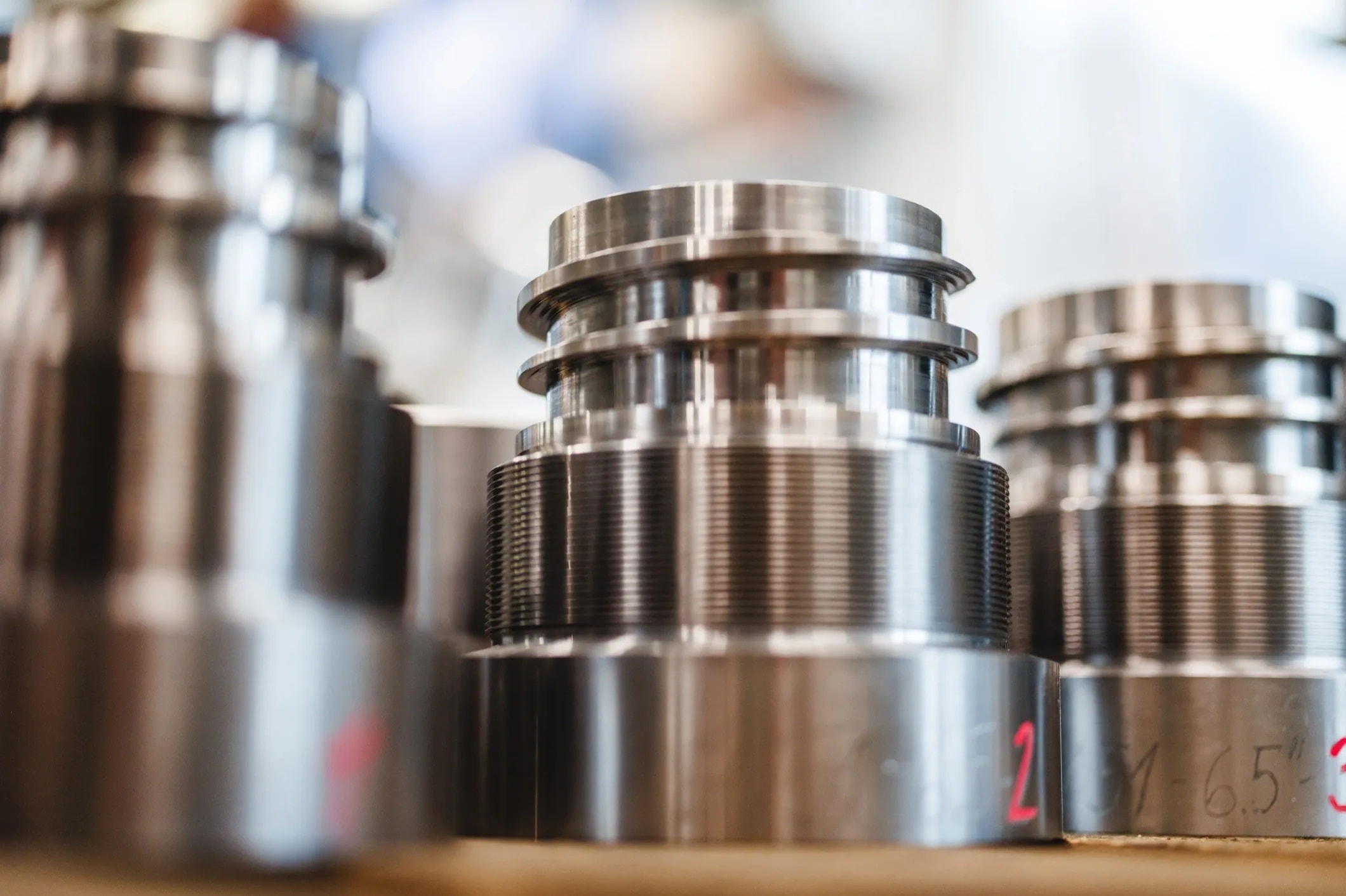 Precision machined metal components requiring tight-tolerance finishing